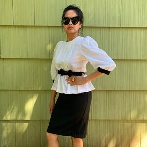 Vintage black and white structured dress with peplum and bow